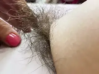 Hairy pussy in white swimsuit closeup