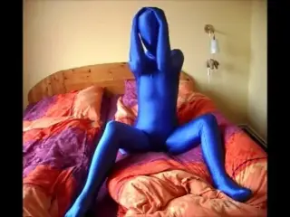 Beautiful woman masturbating in blue zentai