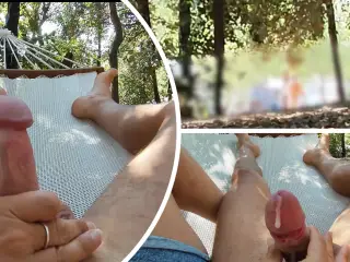 Naked in the park in the hammock he touches my cock until I cum with people passing around - MissCreamy