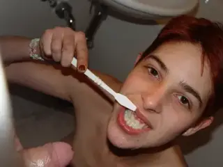 Washing her teeth with Cum and Piss