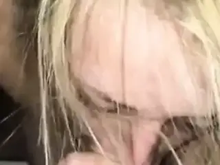 Blond girl is blowing and riding