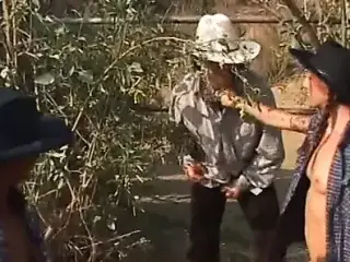 Cowgirls fucking outdoors with strap-ons