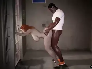 Ginger haired woman fucks a big black dick in prison