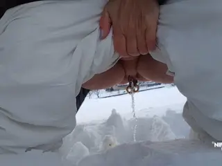 Nipple ring lover pissing outdoor in snow flashing huge pierced nipples and pierced pussy with stretched pussy lips