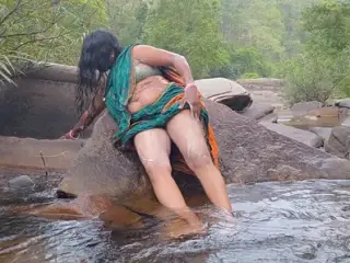 Telugu sexy Silk aunty outdoor waterfall bathing, telugu Dirty talks.