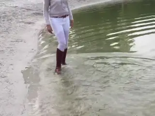 Walking in the lake soaking my brown riding boots