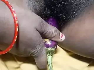 Neetu bhabhi Put Brinjal In his Huge Pussy . And masturbating herself.