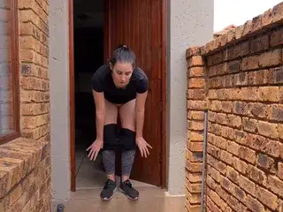 Woman pissing out of the front door