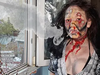 wife smokes cigarette makeup zombie