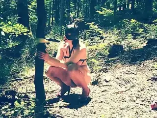 Beautiful slut totally naked in the forest sucking a dildo